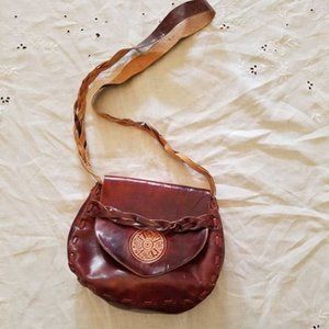 Leather tooled shoulder strap bag